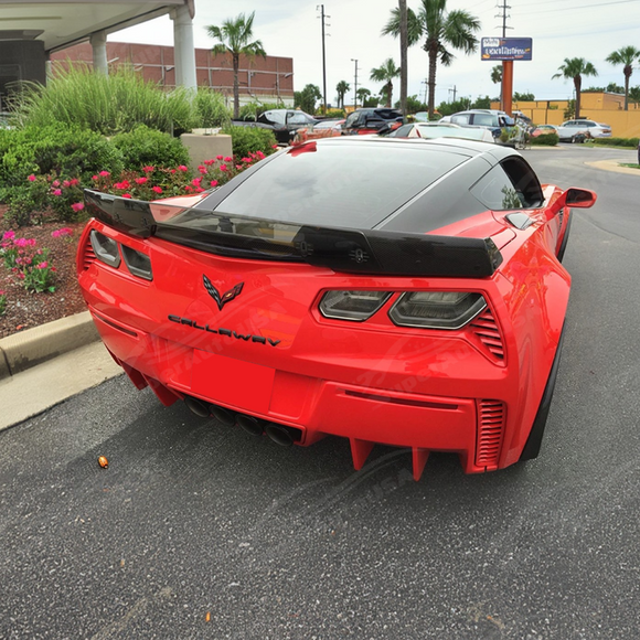 Sleek gloss black trunk lip spoiler with gurney flap installed on C7 Corvette