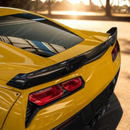 Uninstalled gloss black rear trunk lip spoiler with gurney flap, top view