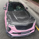 Cadillac CT4 on street with a SuperAutoUSA hood