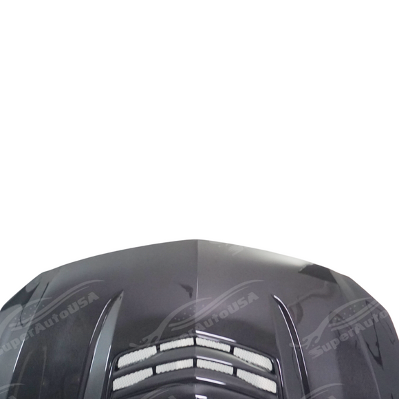 Low angle view emphasizing the carbon fiber hood panel on CT5