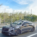 Real carbon fiber V style hood panel on a white Cadillac CT5