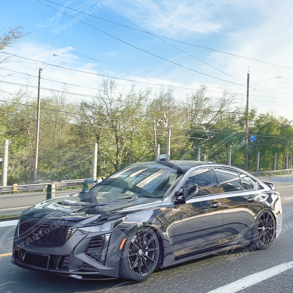 Real carbon fiber V style hood panel on a white Cadillac CT5