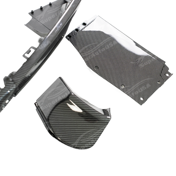 Detailed view of the carbon fiber pattern texture on the rear diffuser lip