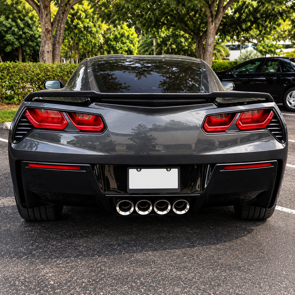 Carbon look C8 Z51 style rear wing providing high-contrast motorsport styling on a Torch Red Corvette C7 Z51