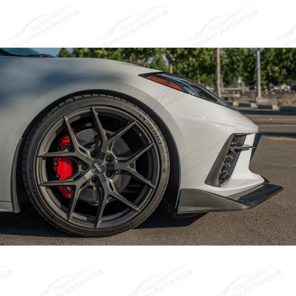 Three-quarter track perspective showing the extended front lip splitter hugging a low-profile wheel fitment on a Corvette C8