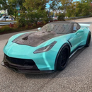 Sleek SuperAutoUSA carbon fiber hood installed on a 2015 Chevrolet Corvette C7