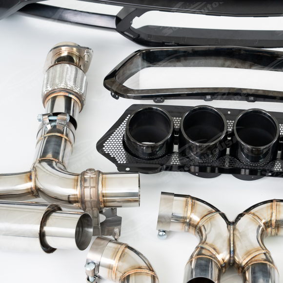 Direct rear view of the quad-tip center-exit SRM exhaust for 2020-2026 Corvette C8