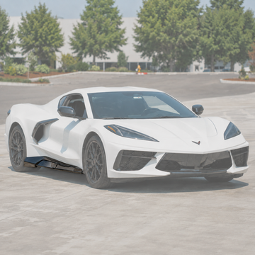 Carbon fiber exotic style wide side skirt extensions installed on a 2020+ Chevrolet Corvette C8 Stingray