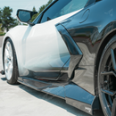 Visual comparison between the factory clean lower rocker and the widened exotic style carbon fiber side skirt