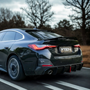 The VTEN roof spoiler adding an aggressive, race-inspired touch to a BMW G22.

