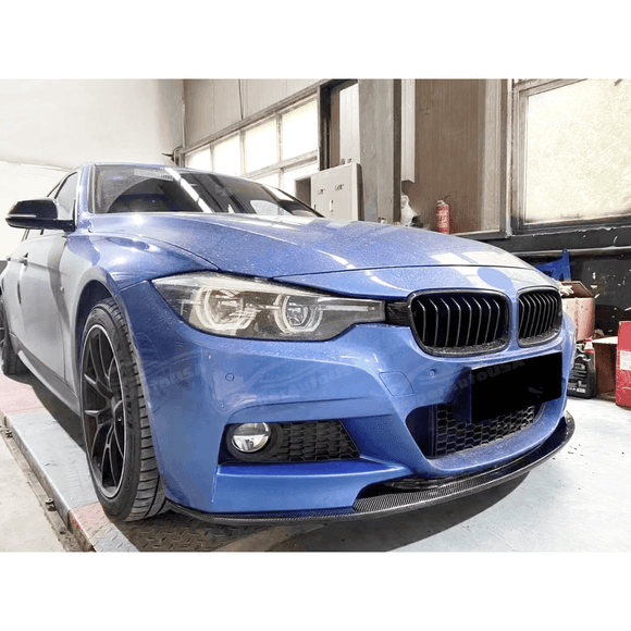 Close-up of the Fits BMW 2012-2019 3-Series F30 M Sport Auto Plus Style Gloss Black Front Lip Spoiler, showcasing the front spoiler lip splitter for a dynamic appearance