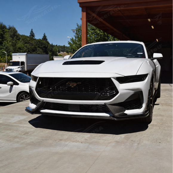 Glossy carbon fiber splitter providing a striking race-inspired contrast on a Grabber Blue S650 Mustang