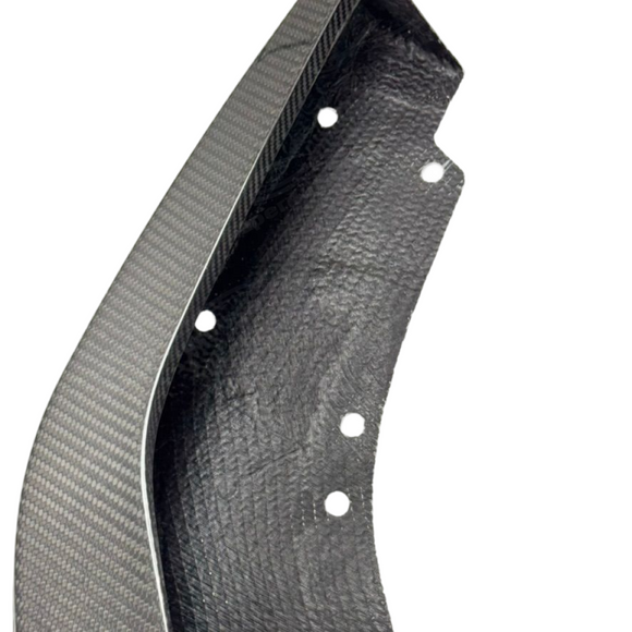 Detailed close-up of the flawless 2x2 twill real carbon fiber weave and mirror gloss clear coat