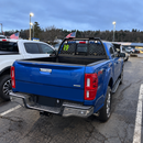 Industrial-grade steel roll bar headache rack installed on a lifted Ford F-250 Super Duty