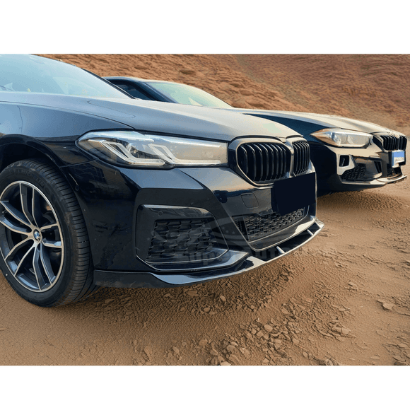 Sleek and aerodynamic design of the Gloss Black Front Bumper Lip Spoiler on the Fit 2021-2024 BMW 5 Series G30, enhancing car performance.