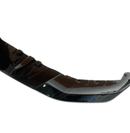 Dynamic view of the BMW 5 Series G30 equipped with a gloss black front splitter spoiler lip, showcasing its stylish and aggressive stance.