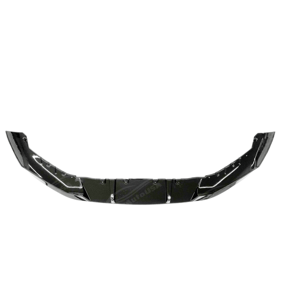 Low angle view of the BMW 5 Series G30 with its gloss black front splitter spoiler lip, emphasizing its ground-hugging design.