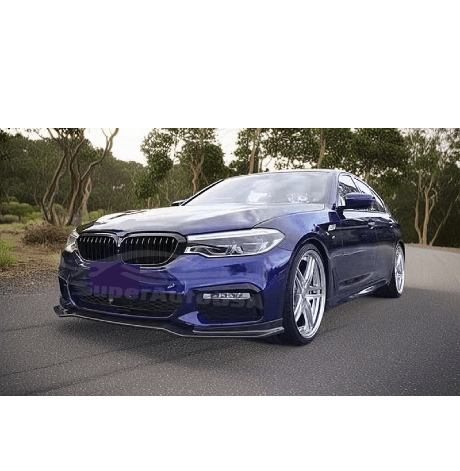 Low angle view showcasing the Fit 2017-2020 BMW 5 Series G30 LCI M Sport Gloss Black Front Bumper Lip Spoiler, highlighting the car's ground-level aerodynamics.