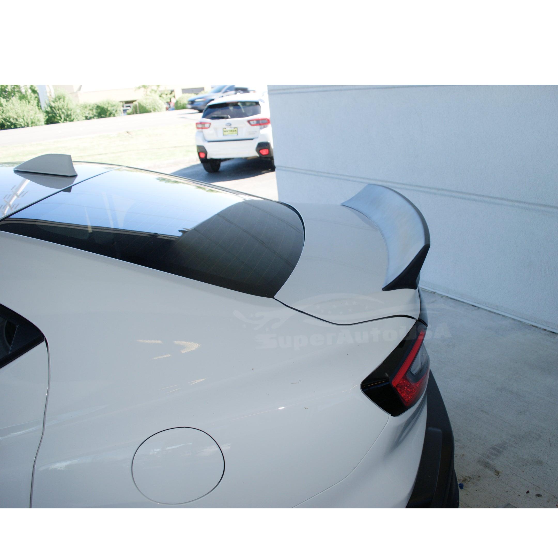 Low angle view of the WRX STI 2022-2024 with its Ceramic White Rear Duckbill Spoiler, accentuating the vehicle's performance-oriented design.