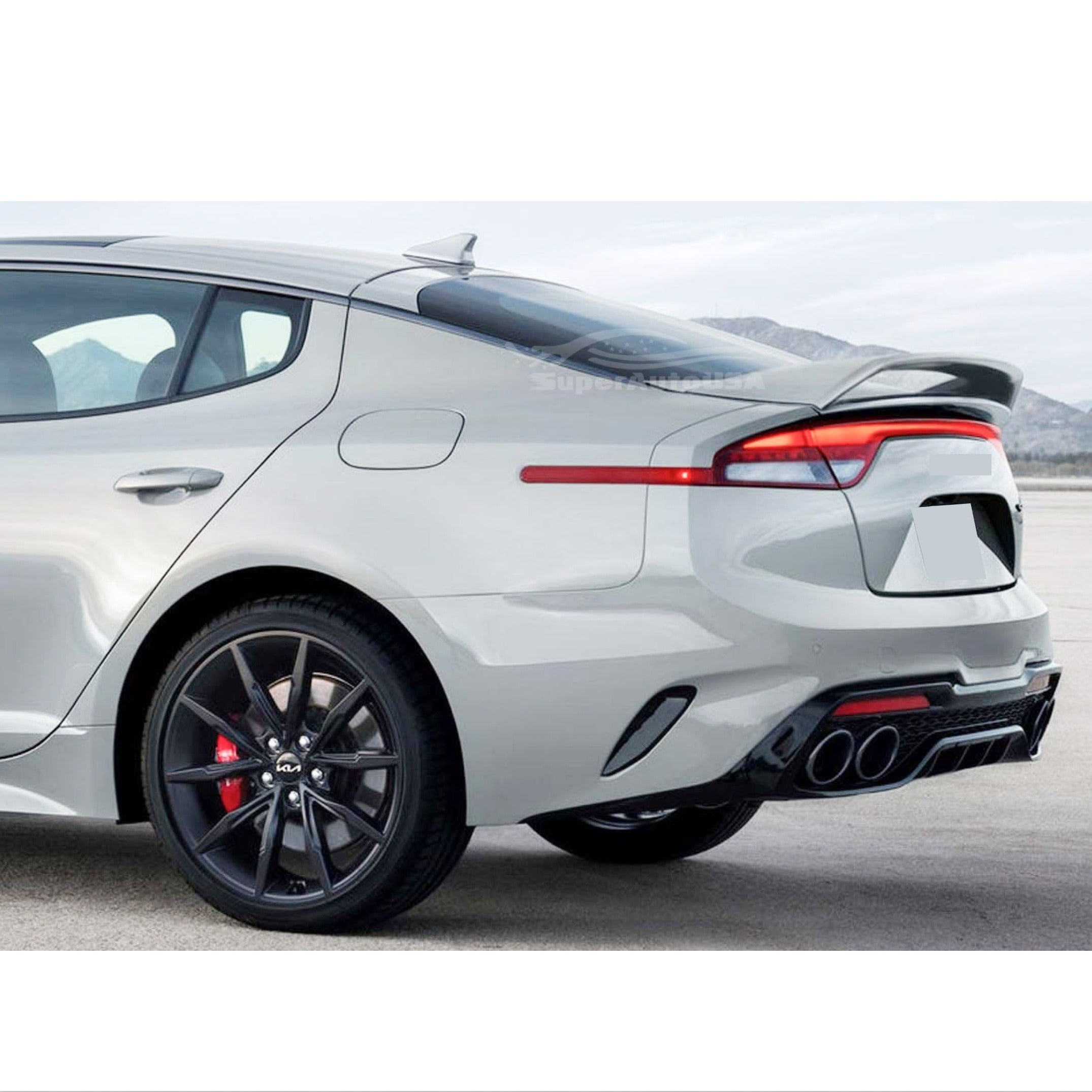 Front-to-back view of the Kia Stinger showcasing the Ceramic Silver Metallic Scorpion GT Style Rear Spoiler, highlighting its role in enhancing vehicle performance