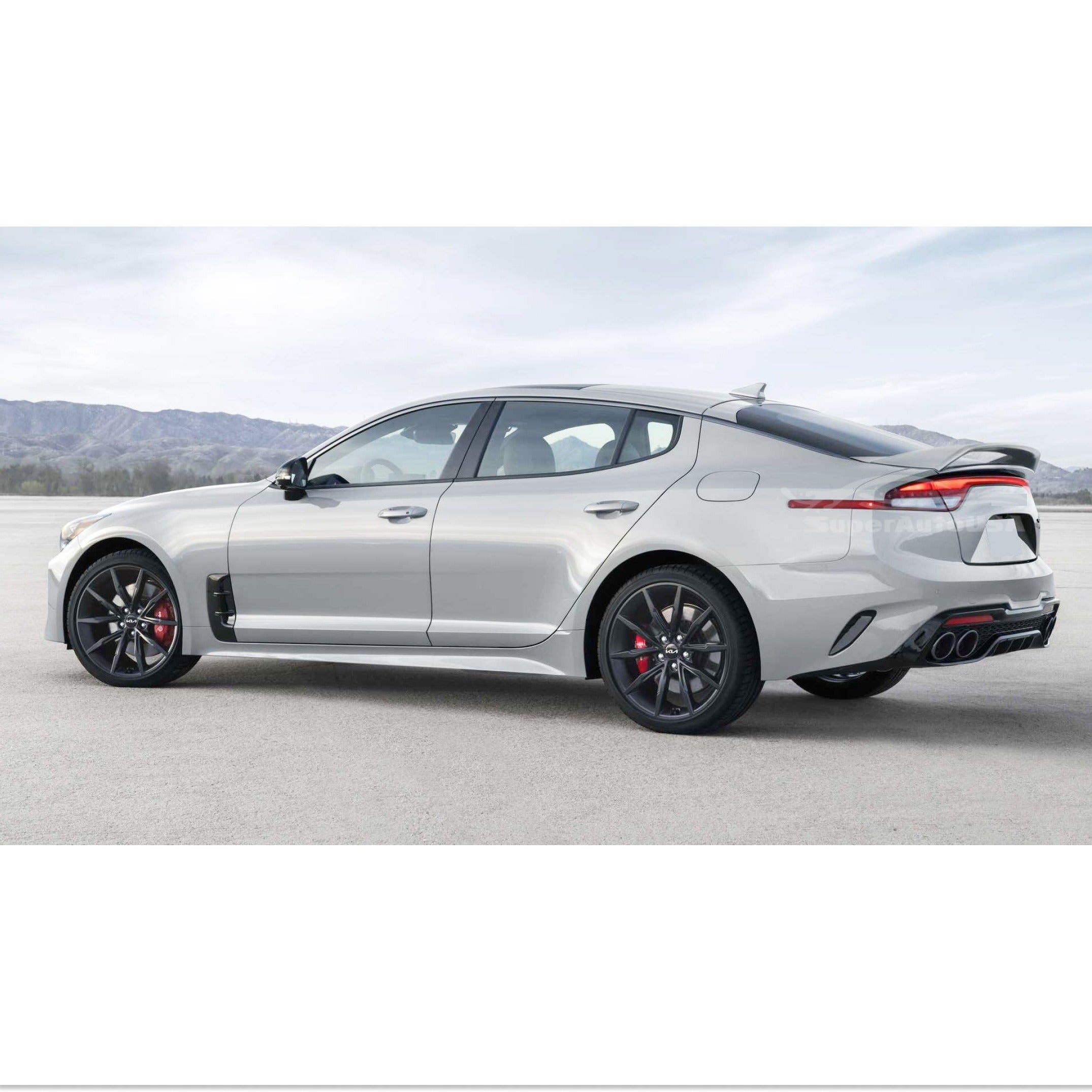 Dynamic angle showing the Kia Stinger with its Ceramic Silver Metallic Scorpion GT Style Rear Trunk Spoiler Wing, illustrating improved performance and style