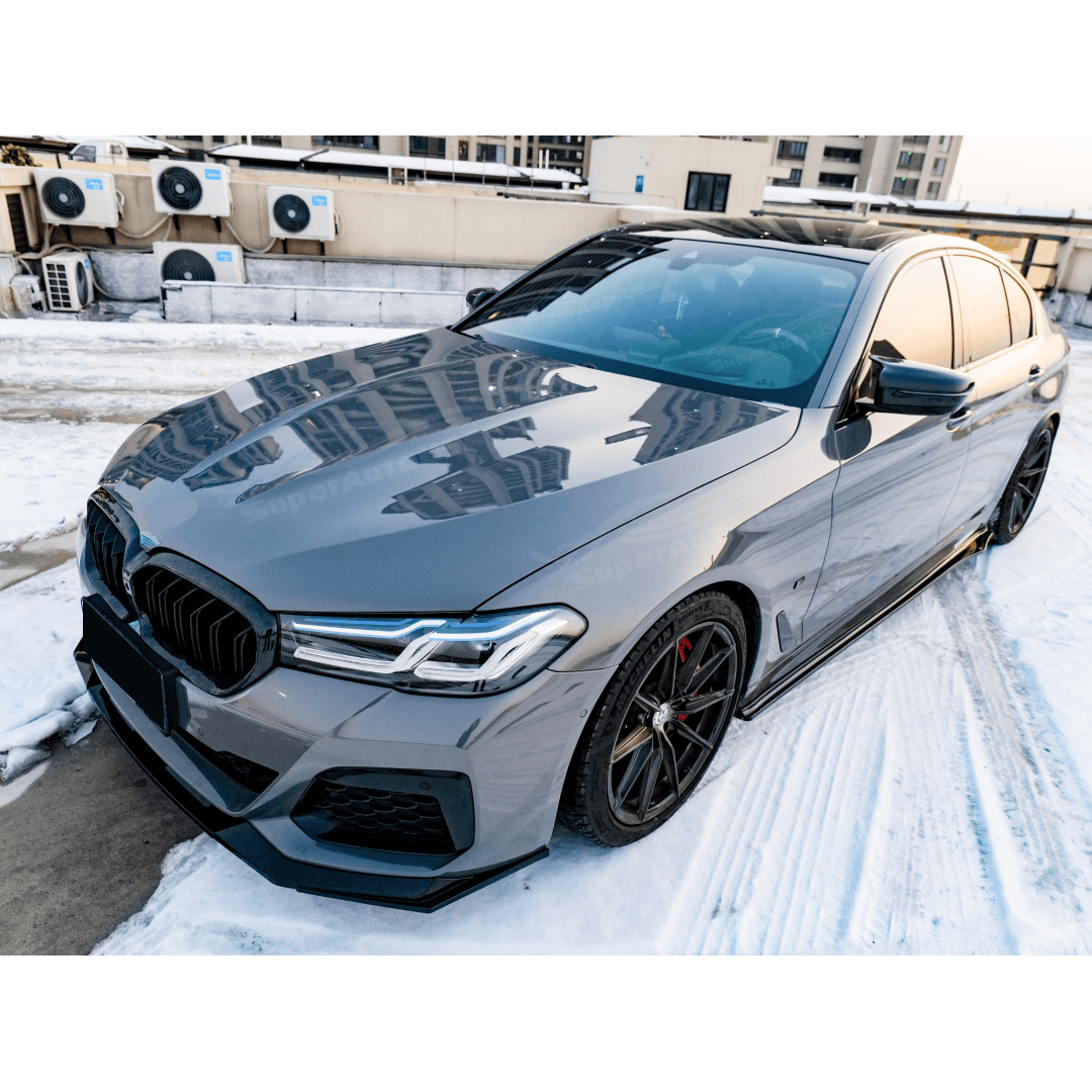 Low angle perspective of the BMW 5 Series G30 530i 540i M550i M-Sport with Gloss Black Front Lip Spoiler, accentuating the car's sporty stance