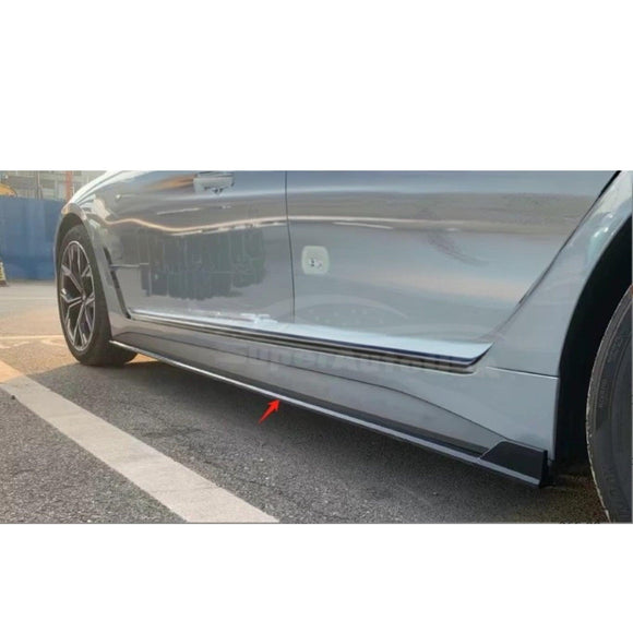 Detailed shot of gloss black side skirt extensions body kit on 2021-2024 BMW 4 Series G26, adding a dynamic side Bottom Extension Lip