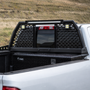 Heavy-duty adjustable reinforced steel roll bar headache rack installed on a Honda Ridgeline truck bed