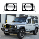 Stainless steel front light guard grilles installed over the headlights on a 2024 INEOS Grenadier Trialmaster Edition