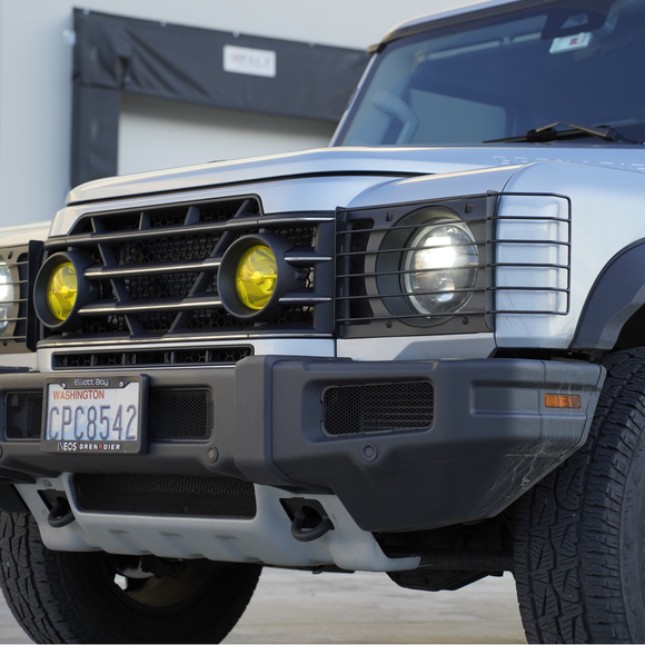 Detailed shot of the custom mounting brackets securing the light cover directly to the factory fascia
