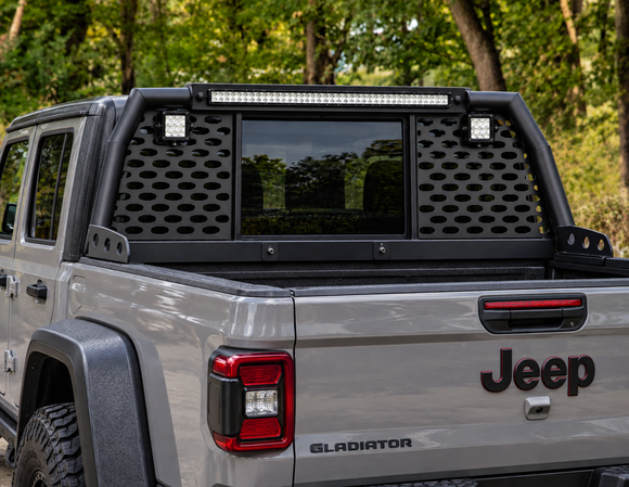 Direct rear view showing high-mounted LED chase light mounts and rear cab window protection screen on a Gladiator