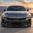 SuperAutoUSA AD style front splitter creating a bold motorsport contrast on a HiChroma Red Kia Stinger GT