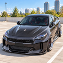 High-contrast styling of the SuperAutoUSA front lower chin splitter mounted on a Snow White Pearl Kia Stinger