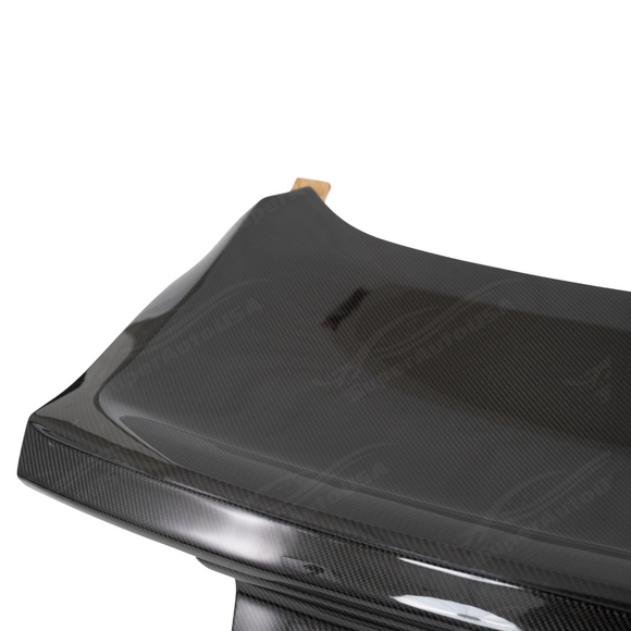 Standalone view of the uninstalled real carbon fiber trunk lid showing the high-gloss surface