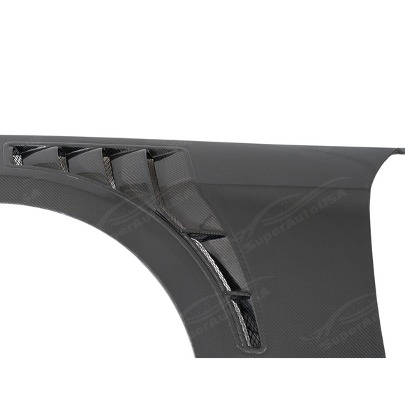 Underside of SUPERAUTOUSA carbon fenders showing vacuum-infused resin and mounting structure