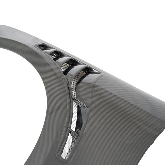 Detailed view of the aggressive aerodynamic side vents on the SUPERAUTOUSA GT500 carbon fenders
