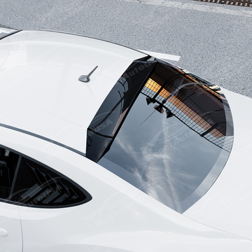 Top-down view highlighting the sleek aerodynamic curvature of the gloss black roof visor