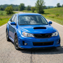 SuperAutoUSA carbon fiber print front splitter lip installed on a final year 2010 STI hatchback