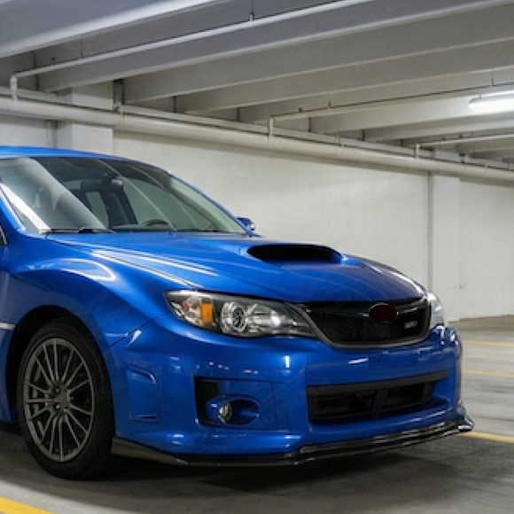 Enhanced street presence of an STI equipped with the SuperAutoUSA carbon fiber print splitter