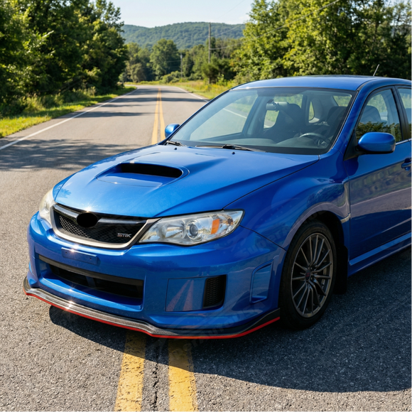 Sporty racing-inspired red detail on the edge of the SuperAutoUSA carbon print front lip
