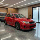 Full 3/4 view of a 2012 Subaru WRX with the carbon fiber print front lip kit