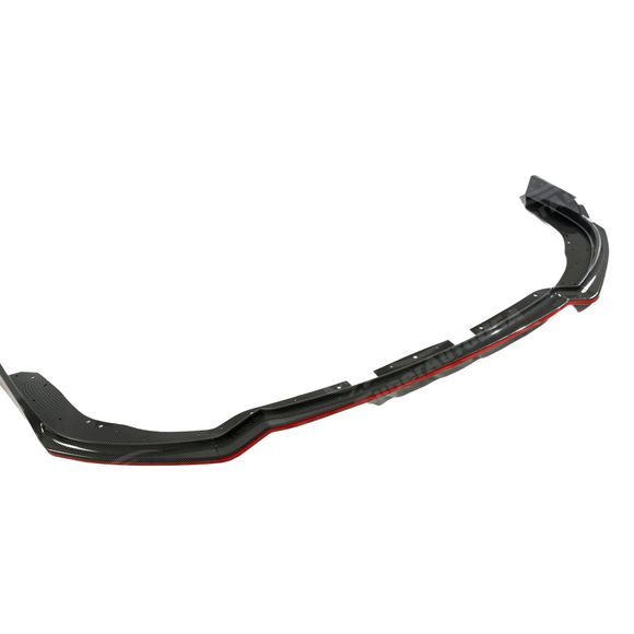 Close-up of the carbon fiber print weave texture and precision red painted edge