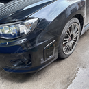 Direct front view of the gloss black side vent covers for 2008-2014 Subaru WRX STI