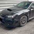 Gloss black side vents providing sharp contrast on a Black SIlica Subaru STI sedan