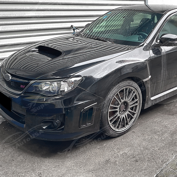Gloss black side vents providing sharp contrast on a Black SIlica Subaru STI sedan