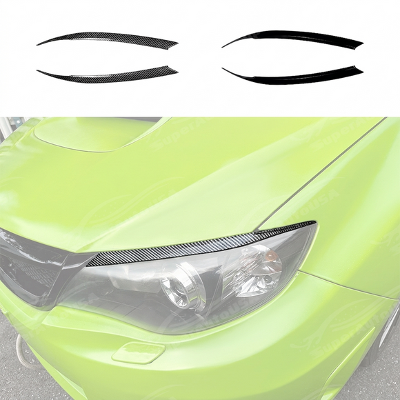 Pair of matte black headlight eyelid overlays installed on a 2011 Subaru WRX STI GV