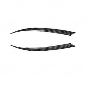 Detailed view of the carbon fiber textured finish on the Subaru Impreza headlight eyelids