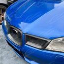 Aggressive carbon print grill surround trim installed on a 2007 Subaru WRX STI