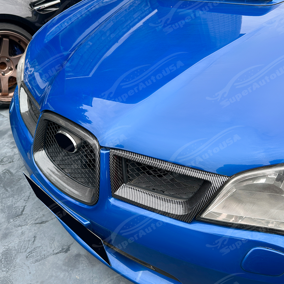 Aggressive carbon print grill surround trim installed on a 2007 Subaru WRX STI
