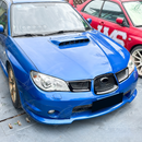 Outdoor shot of the Hawkeye STI featuring the complete gloss black grill transformation